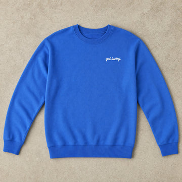 Rufus Packshot 2026 · Le Classique · Brodé « Get lucky. » · Bleu brillant
